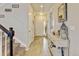Bright entryway featuring wood-look floors, decorative accents, and a view of the staircase at 8071 Tabor St, Arvada, CO 80005