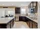 Modern kitchen with stainless steel appliances, granite countertops, and spacious design at 8071 Tabor St, Arvada, CO 80005