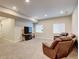 Comfortable living room with recessed lighting, windows, and reclining leather furniture at 8071 Tabor St, Arvada, CO 80005