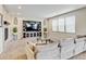 Inviting living room with a fireplace, built-in entertainment center, and comfortable seating at 8071 Tabor St, Arvada, CO 80005