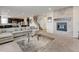 Spacious living room featuring a fireplace, plush seating, and an open floor plan at 8071 Tabor St, Arvada, CO 80005