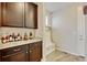 Mud room with storage bench and hooks plus extra cabinets and counter space at 8071 Tabor St, Arvada, CO 80005