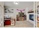 Office featuring a fireplace, neutral carpet, and French doors for enhanced privacy at 8071 Tabor St, Arvada, CO 80005