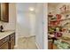 Walk-in pantry provides lots of storage, great for organization with shelving at 8071 Tabor St, Arvada, CO 80005
