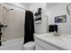 Cozy bathroom featuring a shower-tub combination with stylish fixtures and a black shower curtain for added privacy at 1931 Marlowe W Cir, Erie, CO 80516