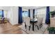Bright dining area featuring a table with seating for six, with views from the sliding doors and large windows at 1931 Marlowe W Cir, Erie, CO 80516