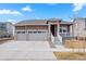 Charming one-story home with a two-car garage and beautiful stone accents at 1931 Marlowe W Cir, Erie, CO 80516