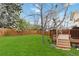 Expansive backyard featuring a wooden deck and a patio area, ideal for outdoor living at 1768 E Jamison Ave, Centennial, CO 80122