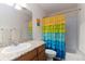 Bathroom featuring a shower/tub combination and a bright, colorful shower curtain at 1768 E Jamison Ave, Centennial, CO 80122