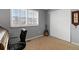 Bedroom with plantation shutters, guitar, and door to closet at 1768 E Jamison Ave, Centennial, CO 80122