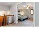 Light-filled bedroom features neutral walls, a ceiling fan and a comfortable king-sized bed at 1768 E Jamison Ave, Centennial, CO 80122