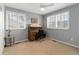 Cozy bedroom with windows, ceiling fan, plantation shutters, desk, and carpeted floor at 1768 E Jamison Ave, Centennial, CO 80122