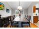 Elegant dining room with a modern chandelier, seating for six, and sleek furniture at 1768 E Jamison Ave, Centennial, CO 80122