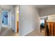 Upstairs hallway with views into multiple rooms and wooden railing at 1768 E Jamison Ave, Centennial, CO 80122