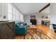 Bright living room with hardwood floors, vaulted ceilings, ample seating, and large windows at 1768 E Jamison Ave, Centennial, CO 80122
