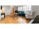 Inviting living room with hardwood floors, bright windows, comfortable seating and stylish decor at 1768 E Jamison Ave, Centennial, CO 80122