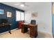 Home office with contrasting walls and a ceiling fan at 1768 E Jamison Ave, Centennial, CO 80122