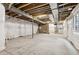 A bright unfinished basement with sealed walls and a window at 8787 Whiteclover St, Littleton, CO 80125