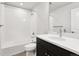 Bathroom featuring a tub shower, dark vanity, white countertops and modern fixtures at 8787 Whiteclover St, Littleton, CO 80125