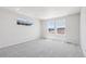 Spacious bedroom with neutral carpet, bright natural light, and backyard views at 8787 Whiteclover St, Littleton, CO 80125