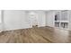 Bright and spacious living room with hardwood floors and sliding glass doors at 8787 Whiteclover St, Littleton, CO 80125
