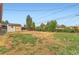Large backyard area with a shed and patchy grass at 272 Balsam Ave, Brighton, CO 80601