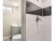 Bathroom with modern fixtures, tiled shower and tub combination, and neutral walls at 272 Balsam Ave, Brighton, CO 80601
