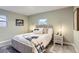 Cozy bedroom with soft lighting, neutral tones and bright windows at 272 Balsam Ave, Brighton, CO 80601
