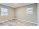 Bright, spacious bedroom with lots of light. Freshly painted with newly installed floors at 272 Balsam Ave, Brighton, CO 80601