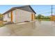 The concrete driveway wraps around the corner with easy access to front door and a second door at 272 Balsam Ave, Brighton, CO 80601