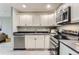 Modern kitchen with stainless appliances, sleek counters, and ample storage at 272 Balsam Ave, Brighton, CO 80601