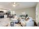 Bright open-concept living space, transitions into dining area with modern stainless steel appliances at 272 Balsam Ave, Brighton, CO 80601