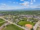 Breathtaking aerial perspective of a community, showcasing its layout and stunning mountain backdrop at 1101 Spruce St, Louisville, CO 80027