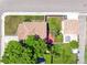 Aerial of property showcasing proximity to other homes with fenced yards and mature landscaping at 1101 Spruce St, Louisville, CO 80027