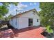 Exterior home view features wood deck, access to backyard, and white siding at 1101 Spruce St, Louisville, CO 80027