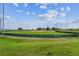Well-maintained baseball field with lush green grass, ready for a game under the blue sky at 1101 Spruce St, Louisville, CO 80027