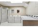 Bright laundry room with double vanity sinks, shower, washer, and dryer at 1101 Spruce St, Louisville, CO 80027