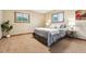 Bedroom featuring neutral walls, carpet, and two windows dressed with wood trim at 1101 Spruce St, Louisville, CO 80027