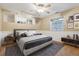 Charming bedroom with modern ceiling fan, decor, and ample lighting at 1101 Spruce St, Louisville, CO 80027
