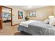 Bedroom with neutral walls, carpet, and a window looking out into the yard at 1101 Spruce St, Louisville, CO 80027
