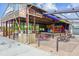 Outdoor community pavilion featuring shaded picnic tables and vibrant signage at 1101 Spruce St, Louisville, CO 80027