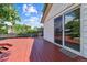 Exterior deck features painted wood flooring and access to backyard and home at 1101 Spruce St, Louisville, CO 80027