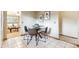 Eat-in kitchen featuring tile flooring, wooden cabinets, and modern white appliances at 1101 Spruce St, Louisville, CO 80027