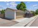 View of a detached two car garage with alley access and a concrete driveway at 1101 Spruce St, Louisville, CO 80027