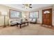 Comfortable living room with large windows for natural light and neutral-toned furnishings at 1101 Spruce St, Louisville, CO 80027