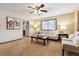 Cozy living room with carpeted floors, a ceiling fan, and natural light from the window at 1101 Spruce St, Louisville, CO 80027