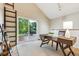 Bright office space with a wooden desk, sliding glass door, and a view of the deck at 1101 Spruce St, Louisville, CO 80027
