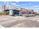 Commercial building featuring retail storefronts, outdoor seating, and ample parking at 1101 Spruce St, Louisville, CO 80027