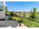 Beautiful backyard with lush greenery, landscaping, and neighborhood views at 2276 S Norse St, Lakewood, CO 80228