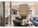 Cozy balcony with an outdoor fireplace and comfortable seating area at 2276 S Norse St, Lakewood, CO 80228